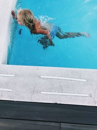 High angle view of woman swimming in pool