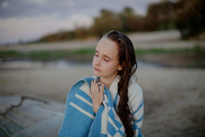 Portrait of teenage girl looking away