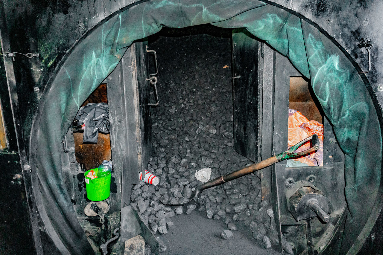 CLOSE-UP OF GARBAGE ON BRIDGE