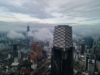 High angle view of buildings in city against sky