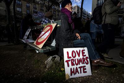 Group of people standing in front of sign