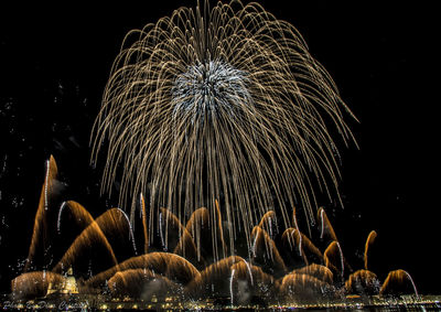 Firework display at night