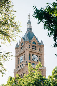 Low angle view of clock tower against sky