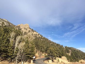 Panoramic view of trees and mountains against sky