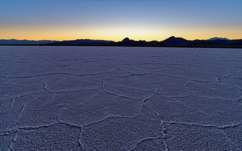 View of salt lake against sky during sunset