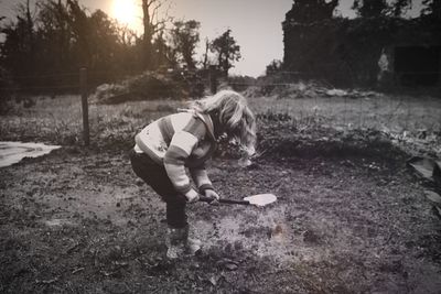 Full length of woman standing on field