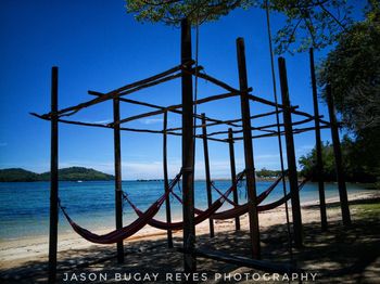 Scenic view of sea against clear blue sky