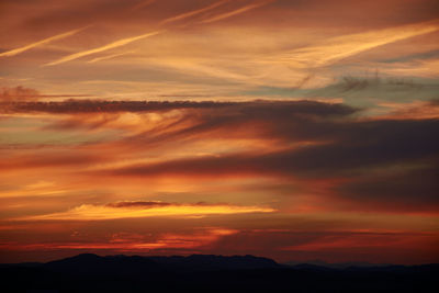 Scenic view of dramatic sky during sunset