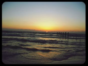 Scenic view of sea at sunset