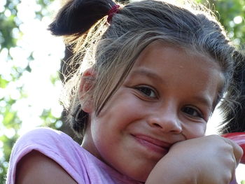 Close-up portrait of smiling cute girl