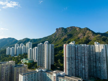 Buildings in city against sky