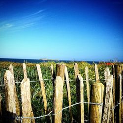 Fence on field against sky