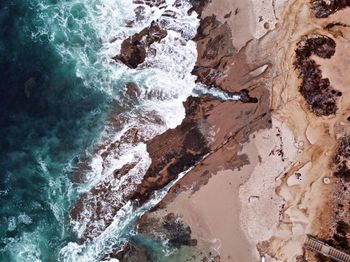 High angle view of rock formation at sea shore