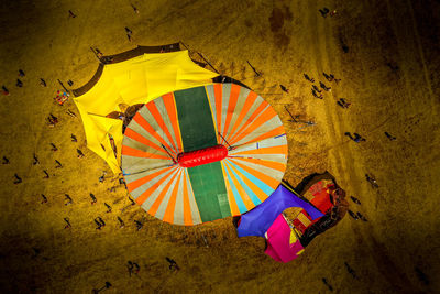 High angle view of multi colored umbrella on wall