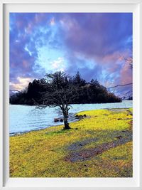 Scenic view of field against cloudy sky