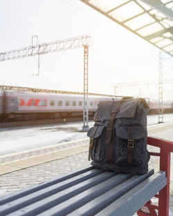 Train at railroad station against sky