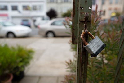 Close-up of padlocks hanging on street