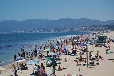 High angle view of people enjoying at beach