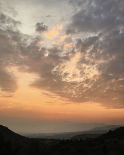 Scenic view of silhouette landscape against sky during sunset