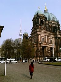 Tourists against clear sky