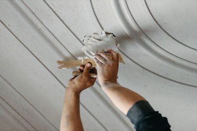 Close up man working with stucco