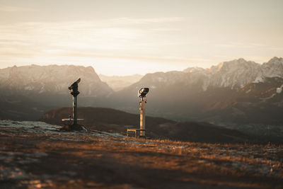 Close-up of monocular against mountain range