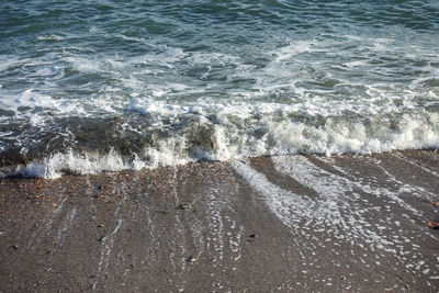 High angle view of surf on beach