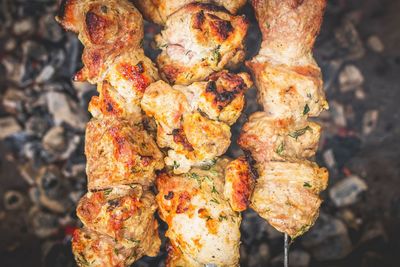 High angle view of meat on barbecue