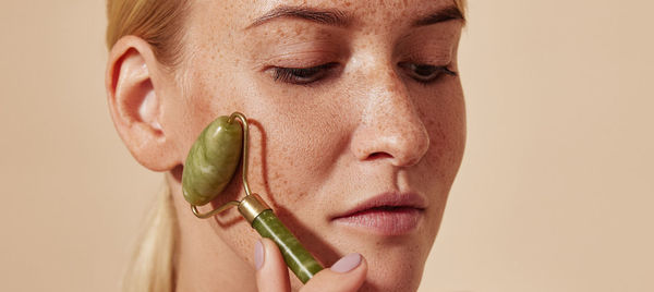 Cropped image of woman holding plant