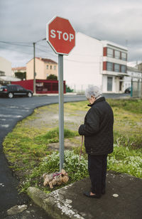 Senior woman going walkies with her yorkshire terrier