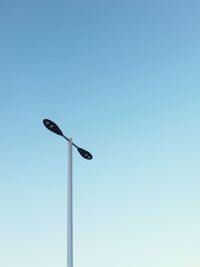 Low angle view of street light against clear sky