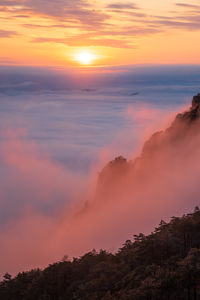 Scenic view of dramatic sky during sunset