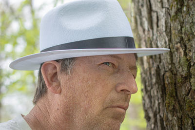 Close-up portrait of man wearing hat