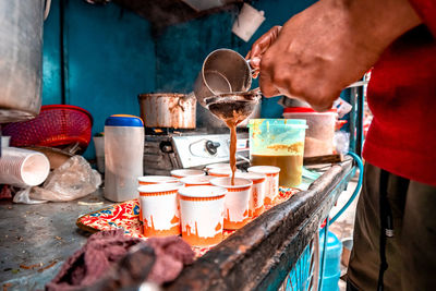 Man preparing food at market stall