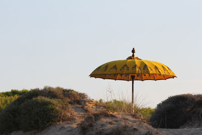 Close-up of umbrella against clear sky