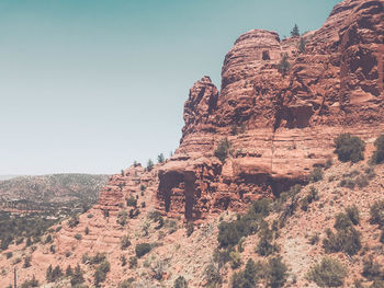 Low angle view of rock formation against sky