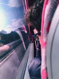 Man looking through train window