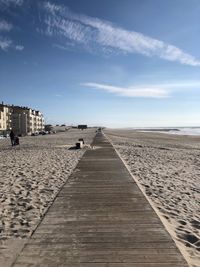 Surface level of beach against sky