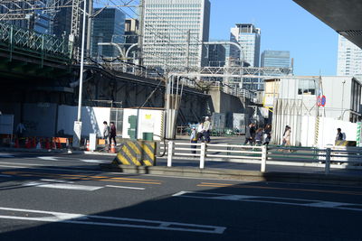 People crossing road in city