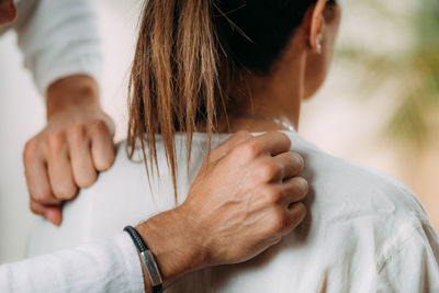 Woman enjoying shiatsu neck and shoulders massage.