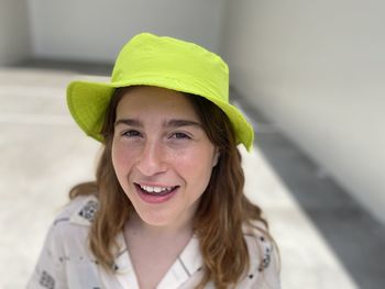 Portrait of woman wearing yellow hat
