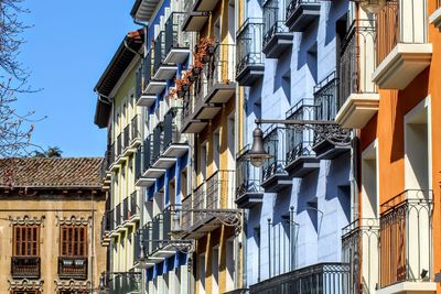 Low angle view of buildings against blue sky