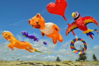 Multi colored balloons against blue sky