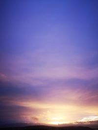 Low angle view of dramatic sky during sunset