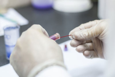 Midsection of doctor examining patient