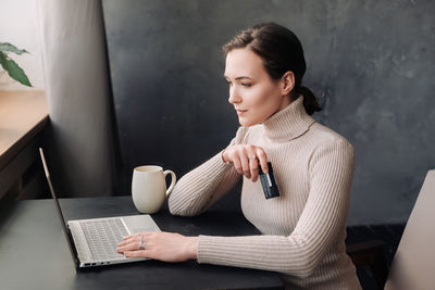 Young woman using mobile phone