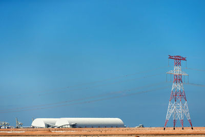 Communications tower against clear blue sky