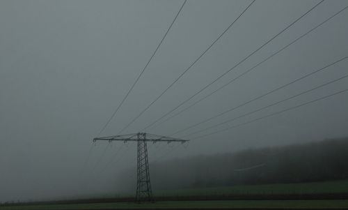 Electricity pylon on field