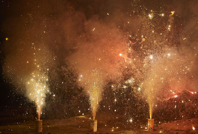 Firework display at night