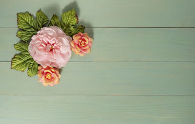 High angle view of pink rose flower on table